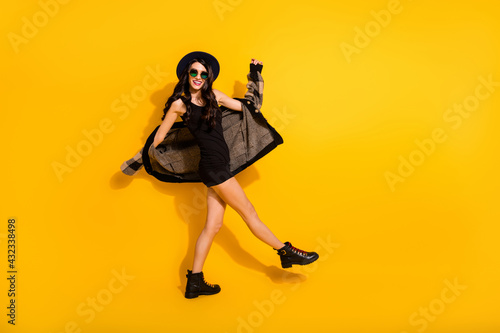 Full size profile photo of positive pretty person have fun partying look camera isolated on yellow color background