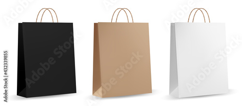 Paper bag template. Brown realistic paper bag. Front and side view of retail purchase packaging - blank mockup with empty space and rope handle.