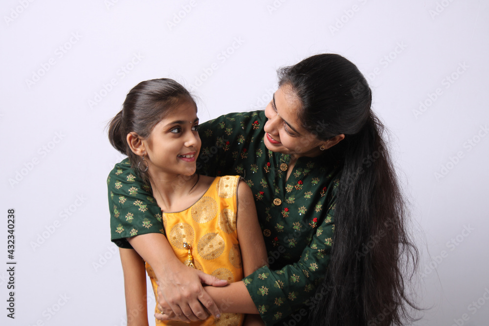 Indian mother daughter on white background. mothers day Indian mother daughter on white background. mothers day