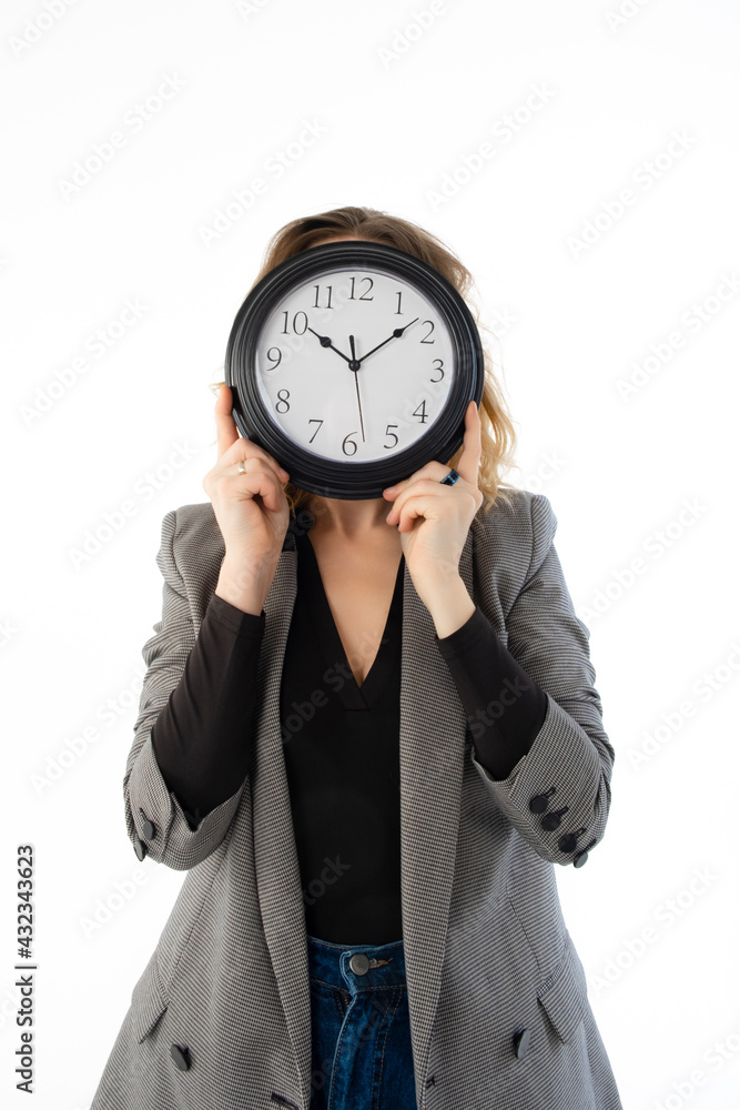A woman holds a watch in front of her face. Isolated on white. Deadline, procrastination concept.