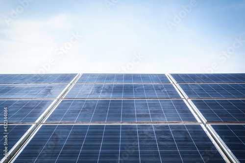 Old Solar panels against blue sky background, Arrangement of solar energy production plant or Solar panels Maintenance Technician Concept photo