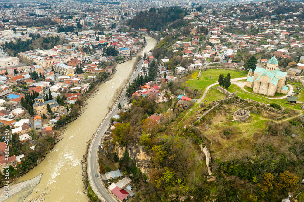 Picturesque aerial view of Georgian town of Kutaisi surrounded by hills