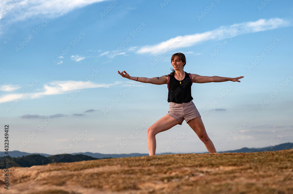 young woman exercising alone outdoor on summer with a big blue sky young woman exercising alone outdoor on summer with a big blue sky