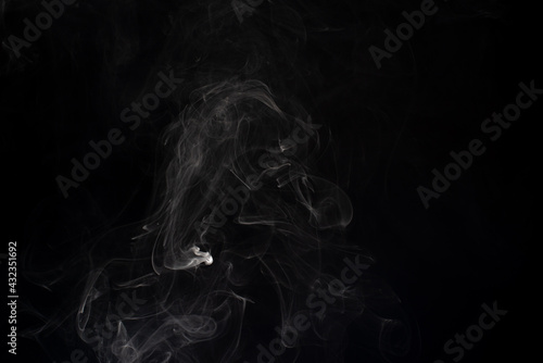 cloud of white smoke on black background