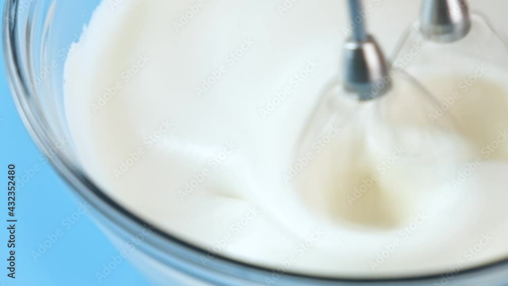 pastry chef use handmixer mixing meringue for cake and bakery. Stock