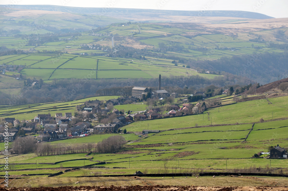 a scenic view of the village of old town in calderdale west yorkshire with surrounding pennine farms and hills