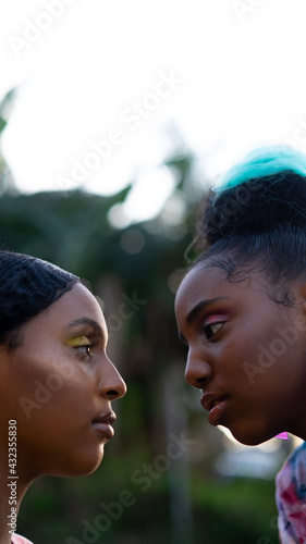 Closeup of young black girls face to face