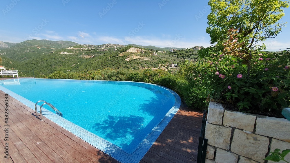 Infinity swimming pool at the guest house. Summer season. Swimming and fun. Beautiful place to enjoy the vacations in Lebanon.