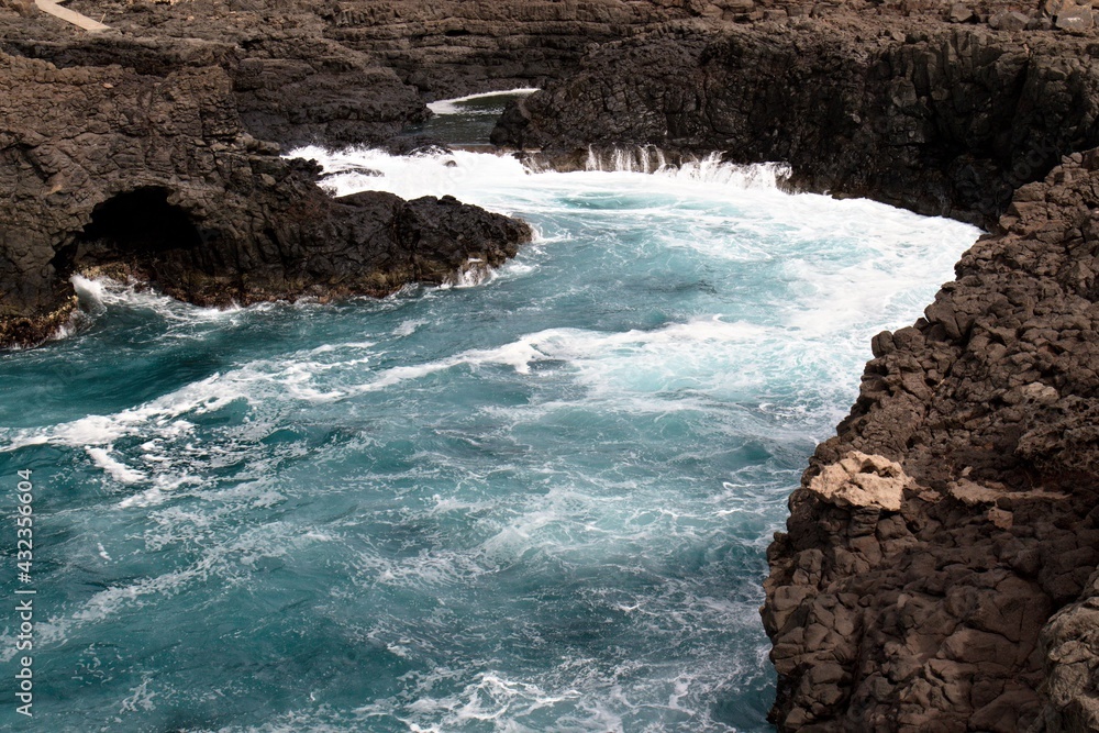 Cape Verde, Sal Island. Near the administrative town of Sal is an interesting and tourist-looking destination of Buracona. The possibility of swimming and watching the Magic Eye. The waves. Cape Verde, Sal Island. Near the administrative town of Sal is an interesting and tourist-looking destination of Buracona. The possibility of swimming and watching the Magic Eye. The waves.