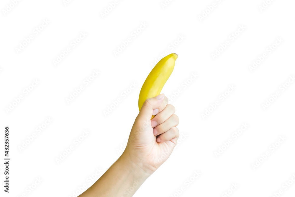 A hand holding a ripe banana on a white background A hand holding a ripe banana on a white background