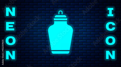 Glowing neon Funeral urn icon isolated on brick wall background. Cremation and burial containers, columbarium vases, jars and pots with ashes. Vector