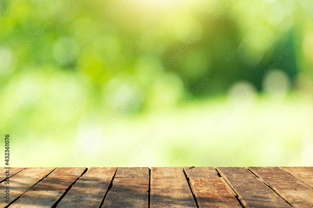 Beautiful wood floor and natural green bokeh background. Beautiful wood floor and natural green bokeh background.