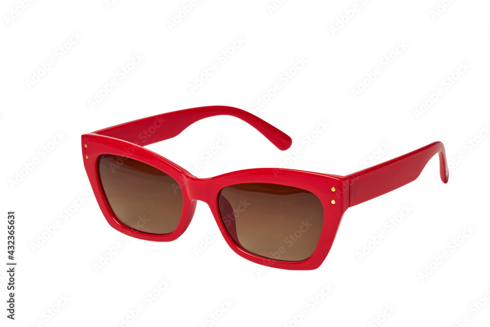 Close-up glasses to protect the eyes from the sun, the frame is red. Dark lenses. White background. Retro style.