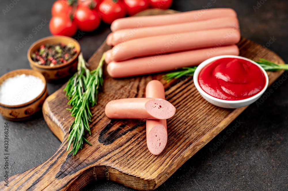 Raw sausages on stone background Raw sausages on stone background