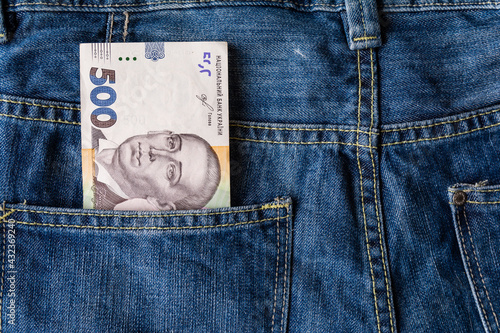 Poverty and unemployment. Concept of financial problems, last money. 500 hryvnias banknote in jeans pocket.