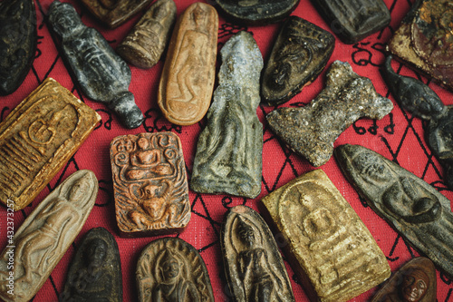 Thai amulets come in a wide variety of styles, Buddhist Sacred,Buddha amulets.	 photo