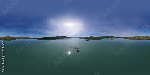 360 degree aerial photo of Ogliastro lake in the heart of Sicily with Etna view. Place of great naturalistic value surrounded by hills planted with cereals. A destination for migratory bird species.