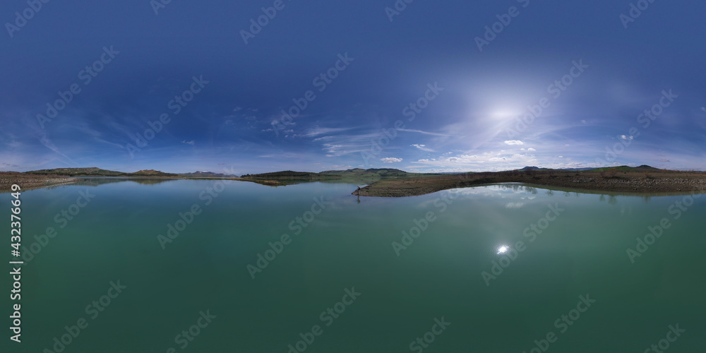 Naklejka premium 360 degree aerial photo of Ogliastro lake in the heart of Sicily with Etna view. Place of great naturalistic value surrounded by hills planted with cereals. A destination for migratory bird species.
