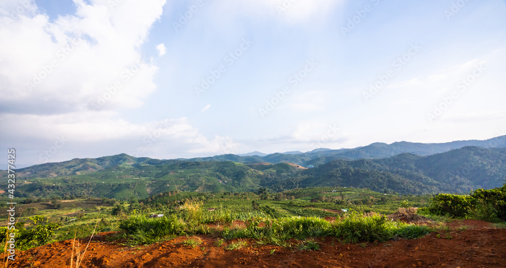 Naklejka premium Beautiful view of local valley and mountain in misty near Bao Loc city, Lam Dong province, Vietnam