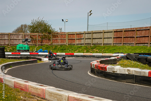 A shot of a racing kart as it circuits a track.