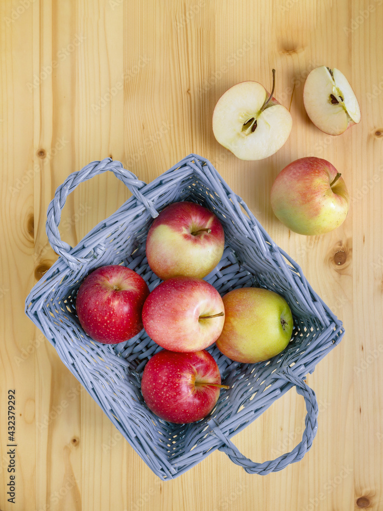 Ripe red and yellow apples in a basket Ripe red and yellow apples in a basket