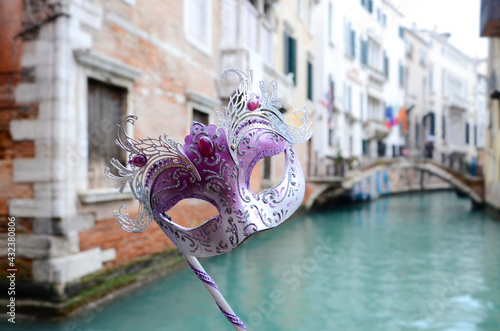 Handmade Face Mask in Venice with background of famous canal,  Venice Italy. - city of love, art and romance