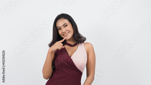 Sexy business woman red dress posing in studio white background. Sexy Asian black hair girl with full lips gesturing to camera. Attractive business female with big breast. posing in studio shooting. 