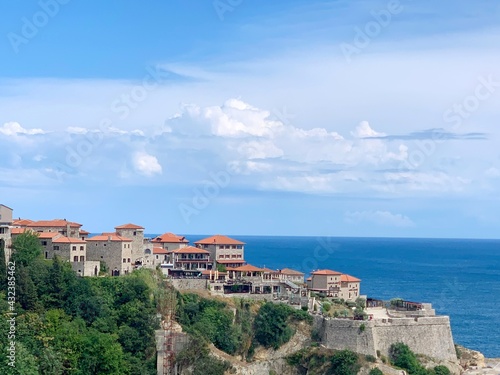 Old town Ulcinj cityscape in Montenegro. Amazing view on blue calm Adriatic sea. Wonderful summer on Mediterranean coast.