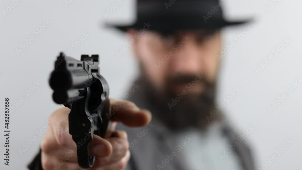 Bandit, gangster or detective pointing gun at camera, isolated on white background. Bandit, gangster or detective pointing gun at camera, isolated on white background.