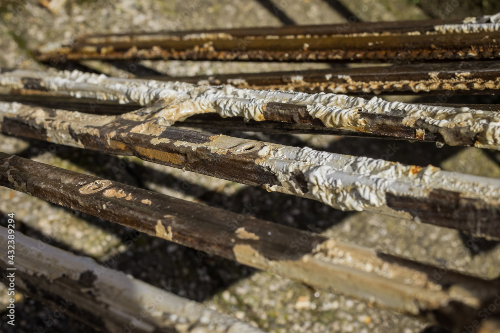 Removal of old paint from metal using chemical acid paint remover. Visible gumming and wrinkling of paint which is about to be removed. Removal of old paint from metal using chemical acid paint remover. Visible gumming and wrinkling of paint which is about to be removed.