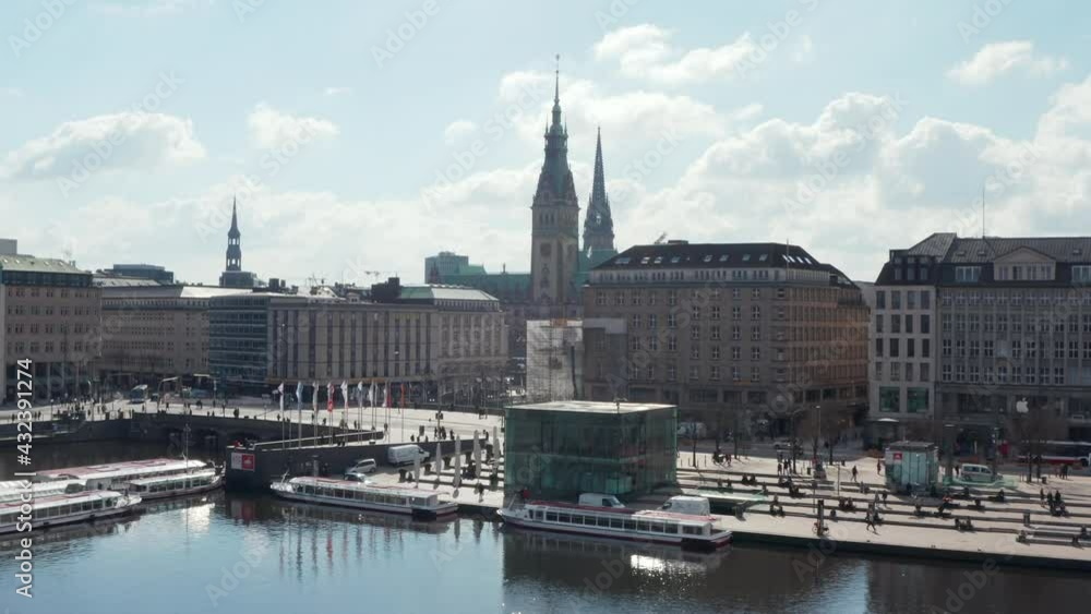 Aerial view of people on the street by Binnenalster lake with Hamburg city hall in the background Aerial view of people on the street by Binnenalster lake with Hamburg city hall in the background