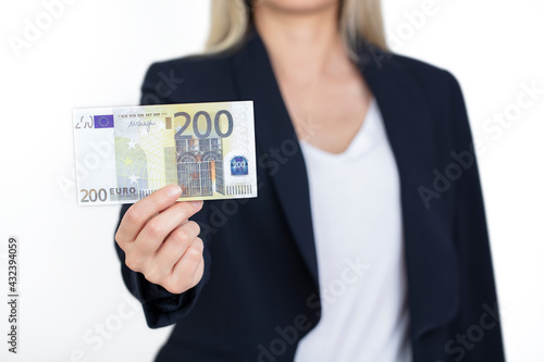 Business woman in suit holding a 200 euro banknote. 