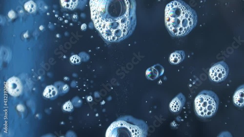 macro photography of soap bubbles the window cleaning chemistry flows down the glass beautifully reflecting