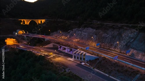 Hyperlapse tuneles sobre la autovía. Túneles de Monrepost en Huesca en un atardecer de invierno. Vehículos en movimiento sobre autopista de montaña photo