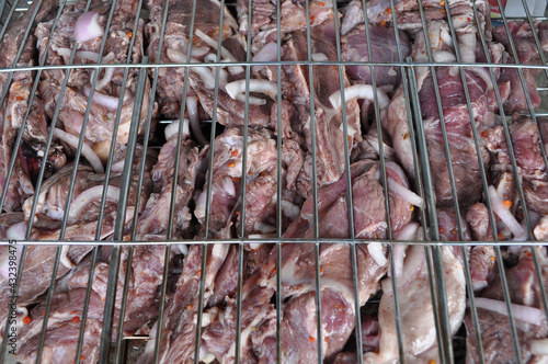 fresh marinated raw uncooked meat for barbecue top view closeup. Selective focus