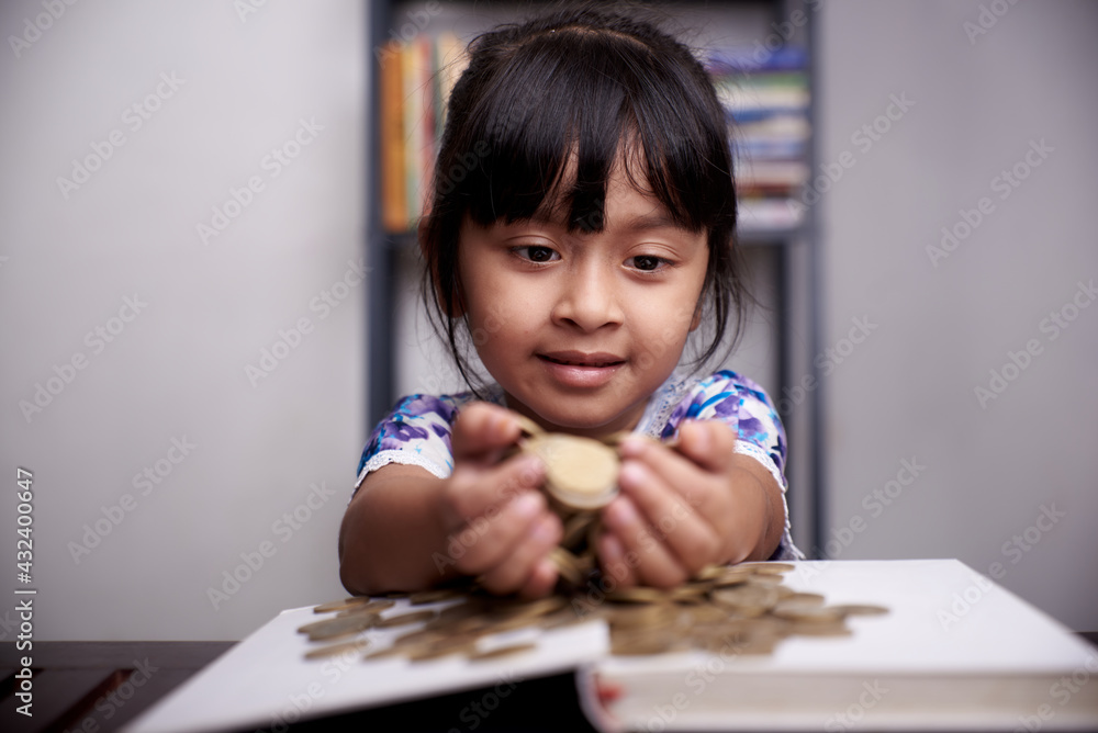 Pretty little Girl holding bunch of gold coins Pretty little Girl holding bunch of gold coins