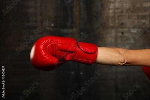 Hand with red boxing glove punching © breakingthewalls