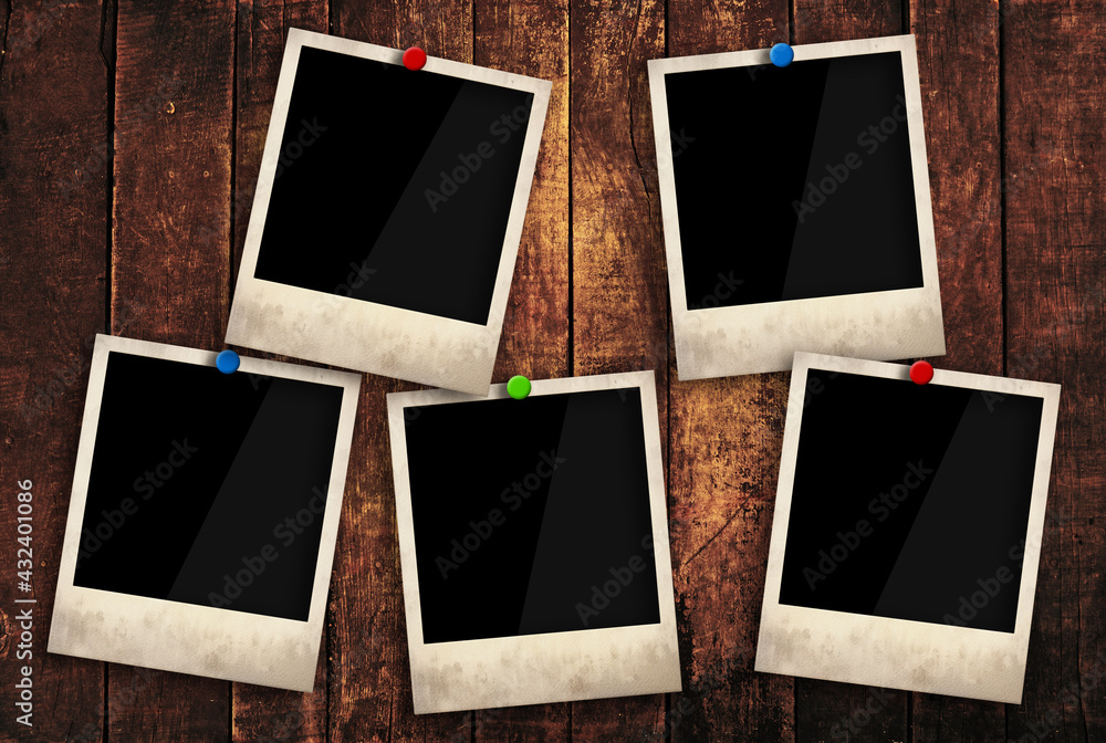 Empty instant photo frames pinned on wooden wall Empty instant photo frames pinned on wooden wall