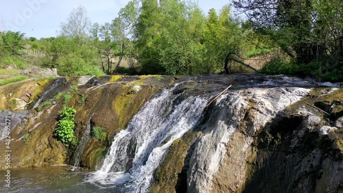 waterfalls in Farnese (VT).
Aerial shot of the waterfalls and the pond immersed in the thick veggetation. photo