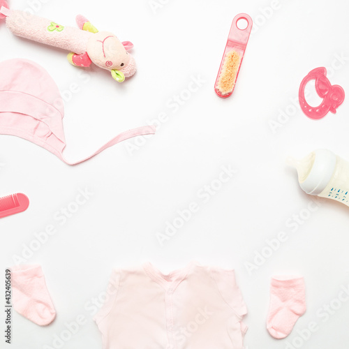 Composition with baby accessories on white background. Frame baby background. Child clothes and accessories for kids. Copy space.