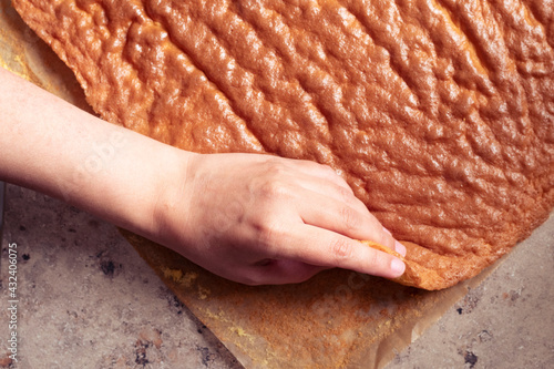 Removing the Swiss roll dough, in Argentina called pionono photo