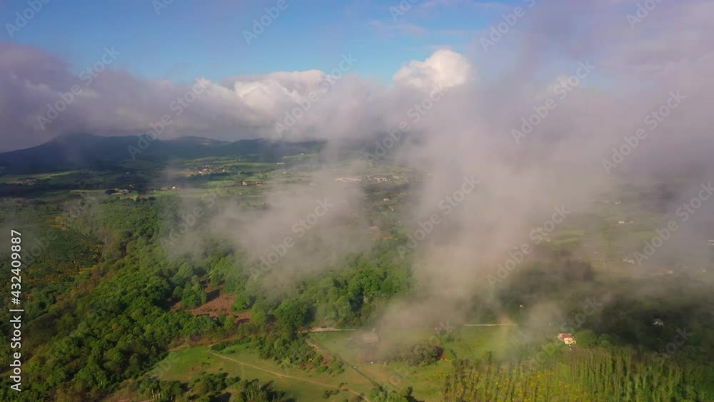 Flying with the drone in the clouds over the Roman countryside
Aerial view with drone on a spring day, on the mountains of Lazio Flying with the drone in the clouds over the Roman countryside
Aerial view with drone on a spring day, on the mountains of Lazio
