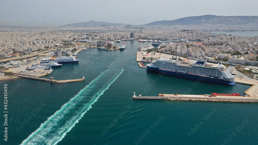 Aerial drone photo of huge cruise liner ready to depart for Aegean destinations anchored in port of Piraeus, Attica, Greece