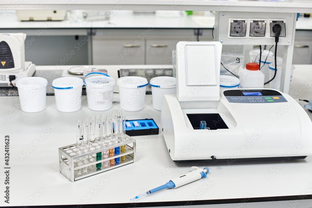 table with equipment and glass test tubes in a chemical laboratory table with equipment and glass test tubes in a chemical laboratory
