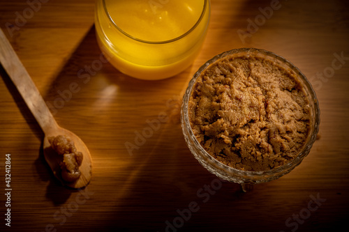 Jaggery Palkova placed next to a jar of Ghee. photo