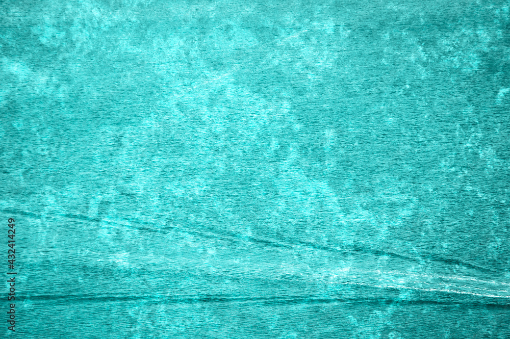Turquoise texture background with trail on water.
