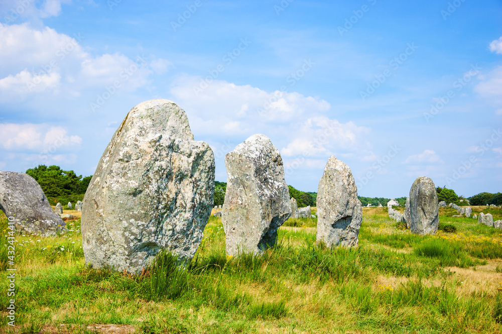 Menhirs - big megalithic monuments near Carnac. Brittany, France. Tourist attractions. 