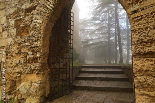 Entrance to the castle in Enna on a foggy day