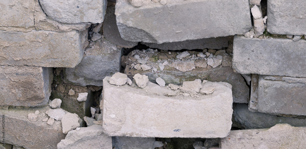 destroyed old white brick wall. close-up of destruction destroyed old white brick wall. close-up of destruction