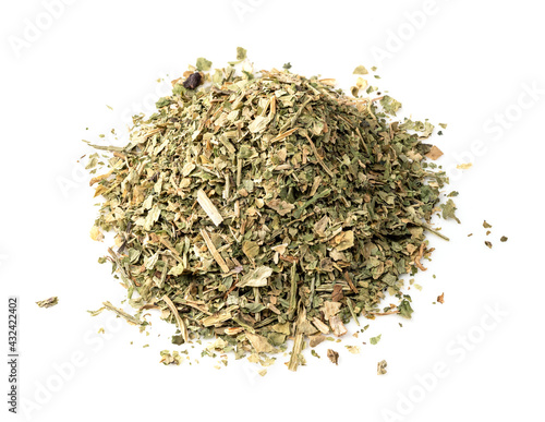 pile of crushed parsley herb closeup on white